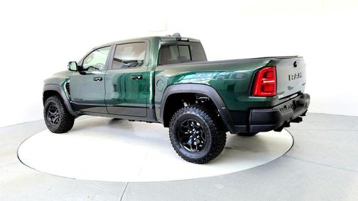 Serrano Green Metallic 2026 RAM 1500 RHO Crew Cab 4x4 5'7' Box