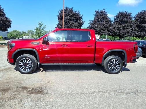 Volcanic Red Tintcoat 2025 GMC Sierra 1500 AT4