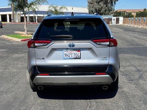 Silver Sky Metallic/Midnight Black Metallic 2023 Toyota RAV4 Hybrid SE