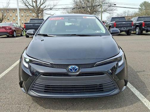 Midnight Black Metallic 2025 Toyota Corolla Hybrid LE