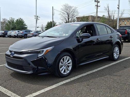 Midnight Black Metallic 2025 Toyota Corolla Hybrid LE