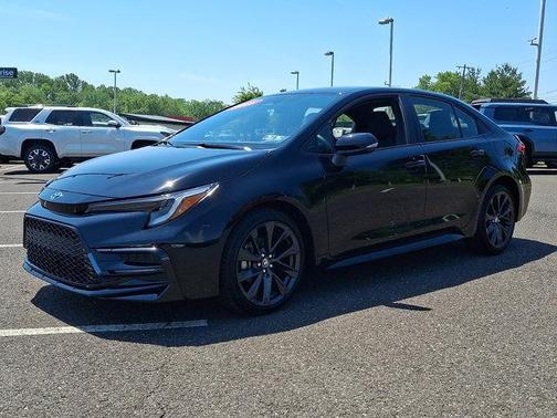 Midnight Black Metallic 2025 Toyota Corolla Hybrid SE