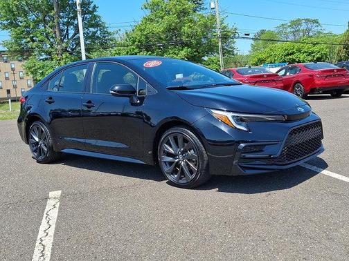 Midnight Black Metallic 2025 Toyota Corolla Hybrid SE