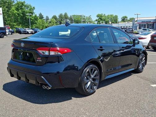 Midnight Black Metallic 2025 Toyota Corolla Hybrid SE