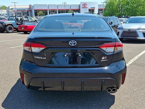Midnight Black Metallic 2025 Toyota Corolla Hybrid SE
