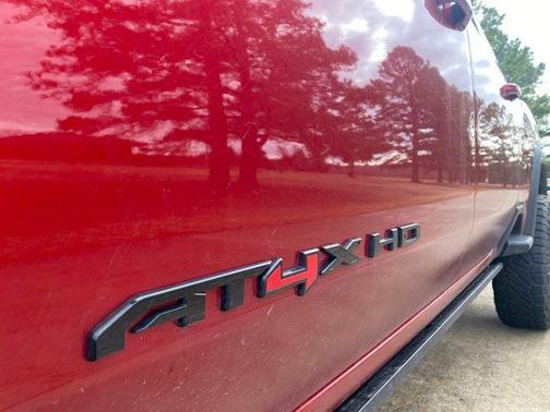 Volcanic Red Tintcoat 2025 GMC Sierra 2500 AT4X