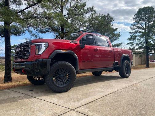 Volcanic Red Tintcoat 2025 GMC Sierra 2500 AT4X