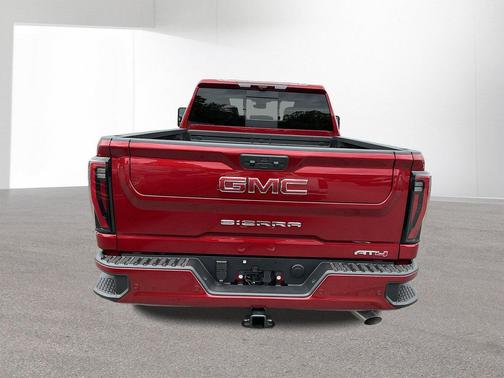 Volcanic Red Tintcoat 2026 GMC Sierra 2500 AT4