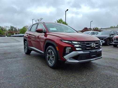 Red 2026 Hyundai TUCSON Hybrid Blue SE