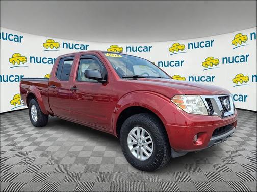 Red 2014 Nissan Frontier SV