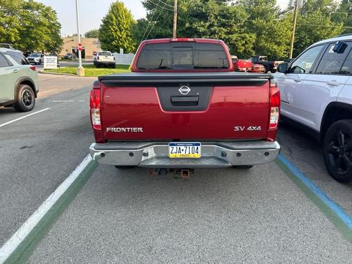 Red 2014 Nissan Frontier SV