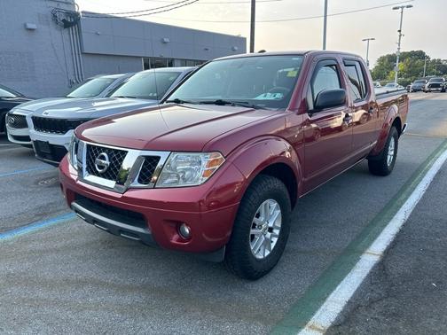 Red 2014 Nissan Frontier SV
