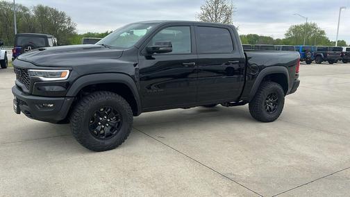 Diamond Black Crystal Pearlcoat 2026 RAM 1500 RHO Crew Cab 4x4 5'7' Box