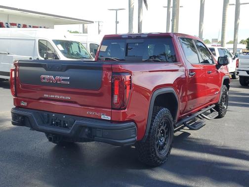 Volcanic Red Tintcoat 2024 GMC Sierra 1500 AT4X