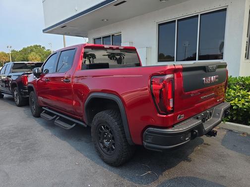 Volcanic Red Tintcoat 2024 GMC Sierra 1500 AT4X