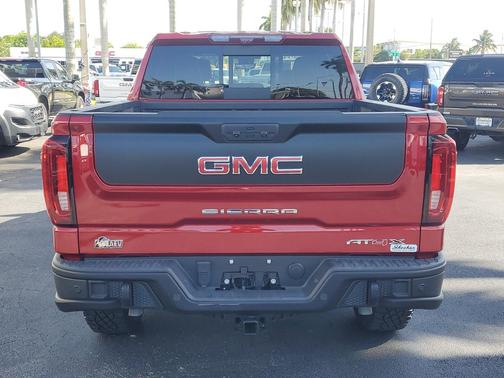 Volcanic Red Tintcoat 2024 GMC Sierra 1500 AT4X