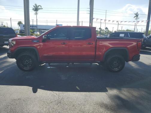Volcanic Red Tintcoat 2024 GMC Sierra 1500 AT4X