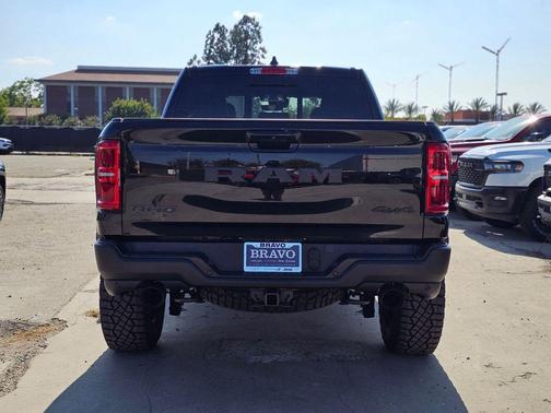 Diamond Black Crystal Pearlcoat 2026 RAM 1500 RHO Crew Cab 4x4 5'7' Box