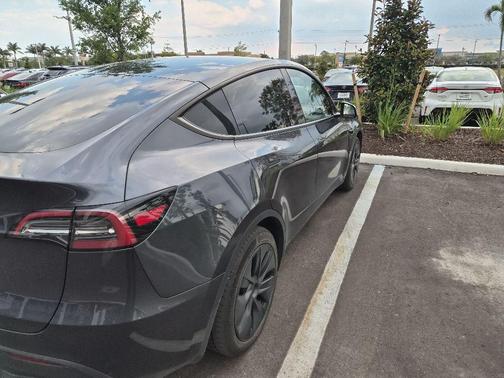 Solid Black 2025 Tesla Model Y Long Range Dual Motor Rear-Wheel Drive
