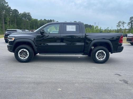 Diamond Black Crystal Pearlcoat 2026 RAM 1500 RHO Crew Cab 4x4 5'7' Box