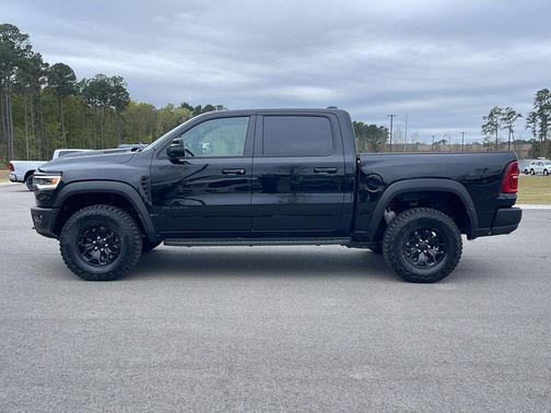 Diamond Black Crystal Pearlcoat 2026 RAM 1500 RHO Crew Cab 4x4 5'7' Box