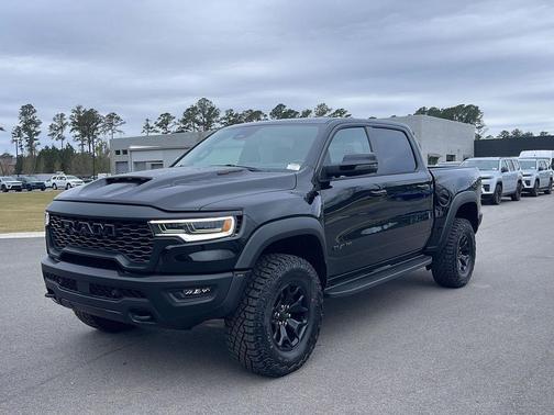 Diamond Black Crystal Pearlcoat 2026 RAM 1500 RHO Crew Cab 4x4 5'7' Box