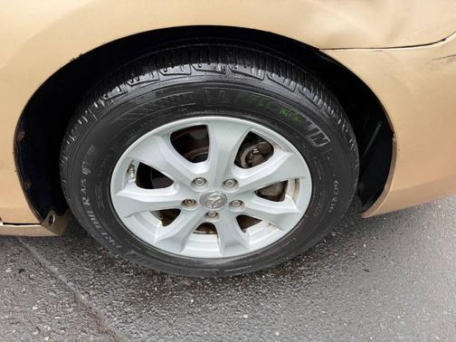 Tan 2010 Toyota Camry LE