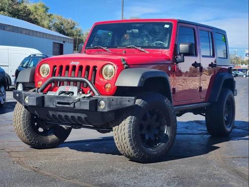 Red 2010 Jeep Wrangler Unlimited Sport