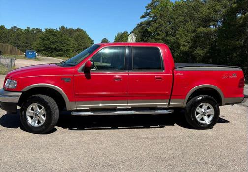 Red 2002 Ford F-150 King Ranch SuperCrew
