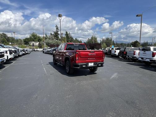 Volcanic Red Tintcoat 2024 GMC Sierra 1500 AT4X