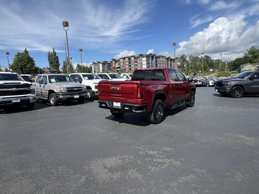 Volcanic Red Tintcoat 2024 GMC Sierra 1500 AT4X