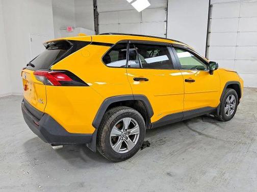Yellow 2023 Toyota RAV4 Hybrid LE