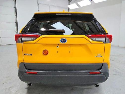 Yellow 2023 Toyota RAV4 Hybrid LE