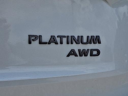 Everest White Pearl TriCoat / Super Black Two-tone 2026 Nissan Rogue Platinum
