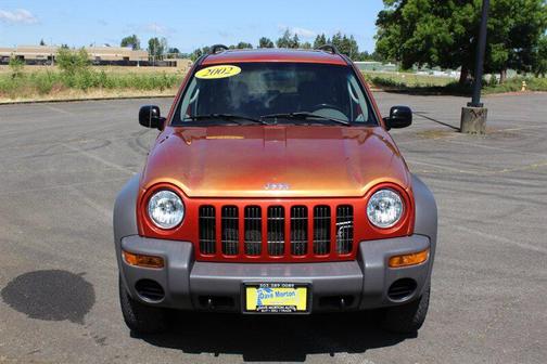 Orange 2002 Jeep Liberty Sport