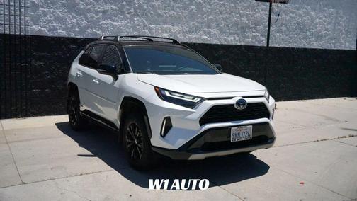 Wind Chill Pearl/Midnight Black Metallic 2024 Toyota RAV4 Hybrid SE
