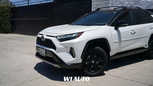 Wind Chill Pearl/Midnight Black Metallic 2024 Toyota RAV4 Hybrid SE