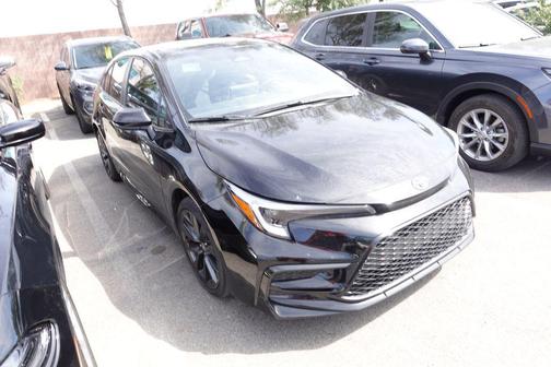 Midnight Black Metallic 2025 Toyota Corolla Hybrid SE