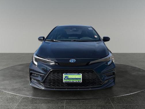 Midnight Black Metallic 2024 Toyota Corolla Hybrid SE