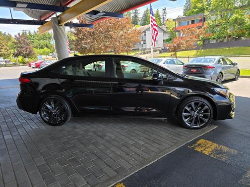 Midnight Black Metallic 2024 Toyota Corolla Hybrid SE