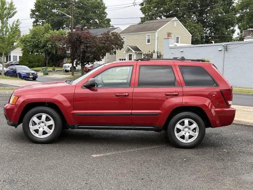 Red 2009 Jeep Grand Cherokee Laredo