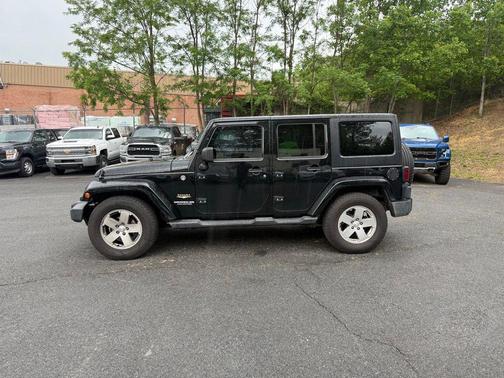 Black Clearcoat 2011 Jeep Wrangler Unlimited Sahara