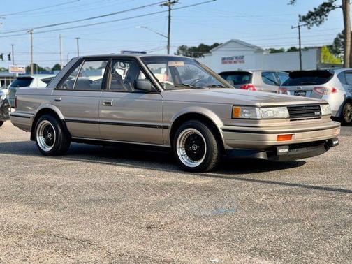 Gold 1987 Nissan Maxima SE