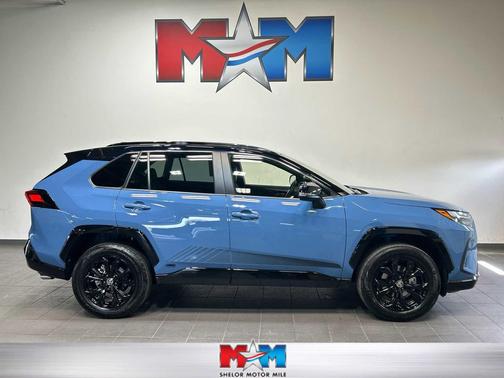Cavalry Blue/Midnight Black Metallic 2024 Toyota RAV4 Hybrid SE