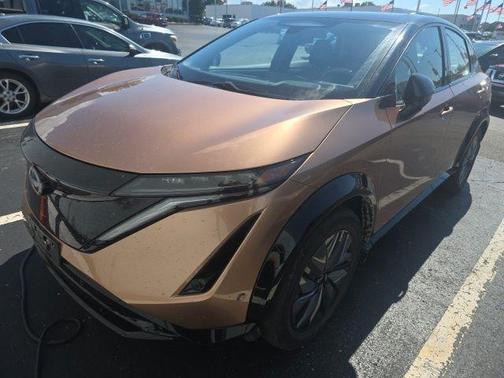 Sunrise Copper Pearl/Black Diamond Pearl 2024 Nissan ARIYA PLATINUM+ e-4ORCE