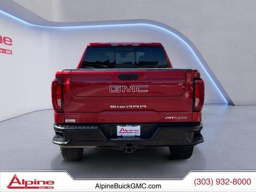 Volcanic Red Tintcoat 2024 GMC Sierra 1500 AT4X