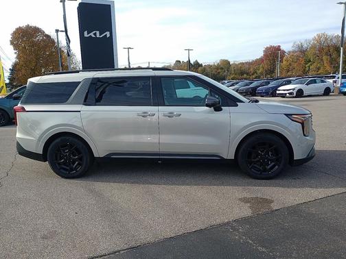 Ivory Silver 2026 Kia Carnival Hybrid SX