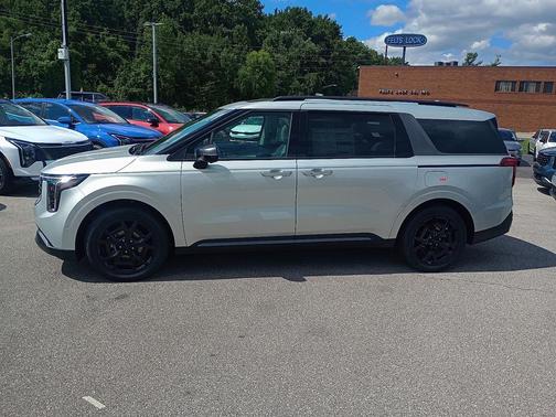 Ivory Silver 2026 Kia Carnival Hybrid SX