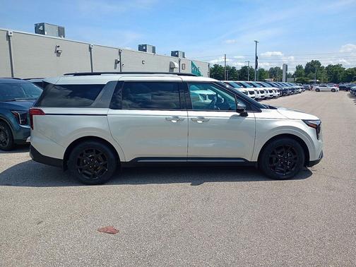 Ivory Silver 2026 Kia Carnival Hybrid SX