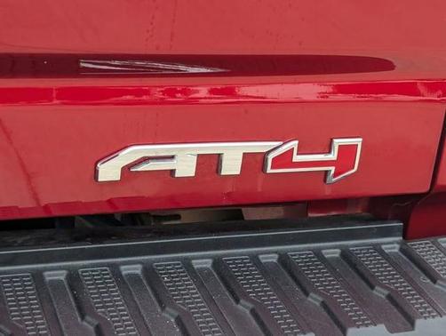 Volcanic Red Tintcoat 2025 GMC Sierra 2500 AT4
